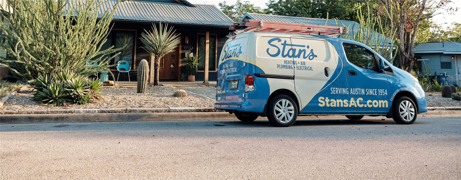 Stan's Heating, Air, Plumbing and Electrical service van parked in front of an Austin home